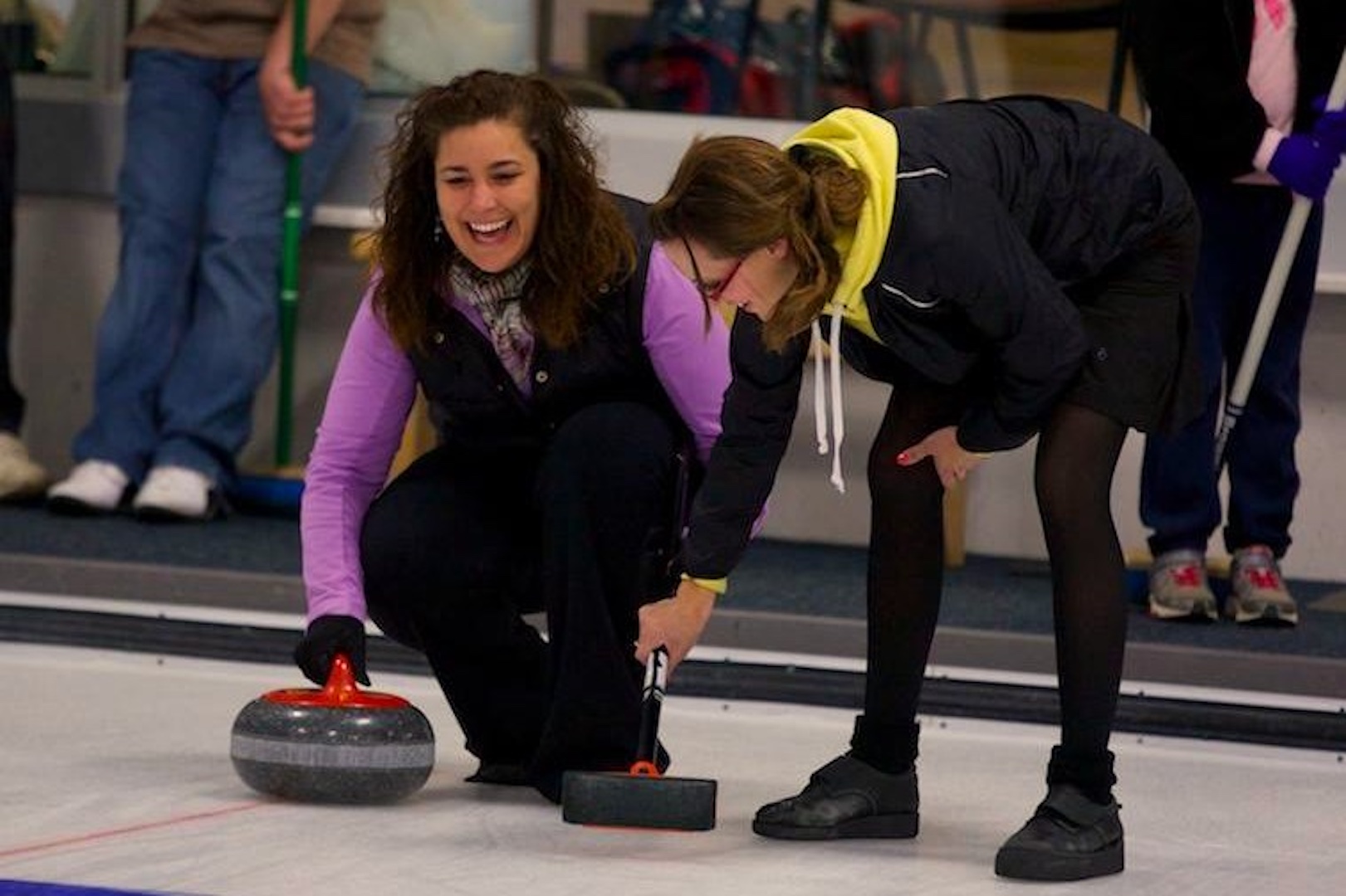 Participants learning how to curl